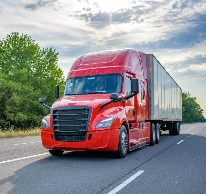 red tractor trailer driving down South Carolina highway