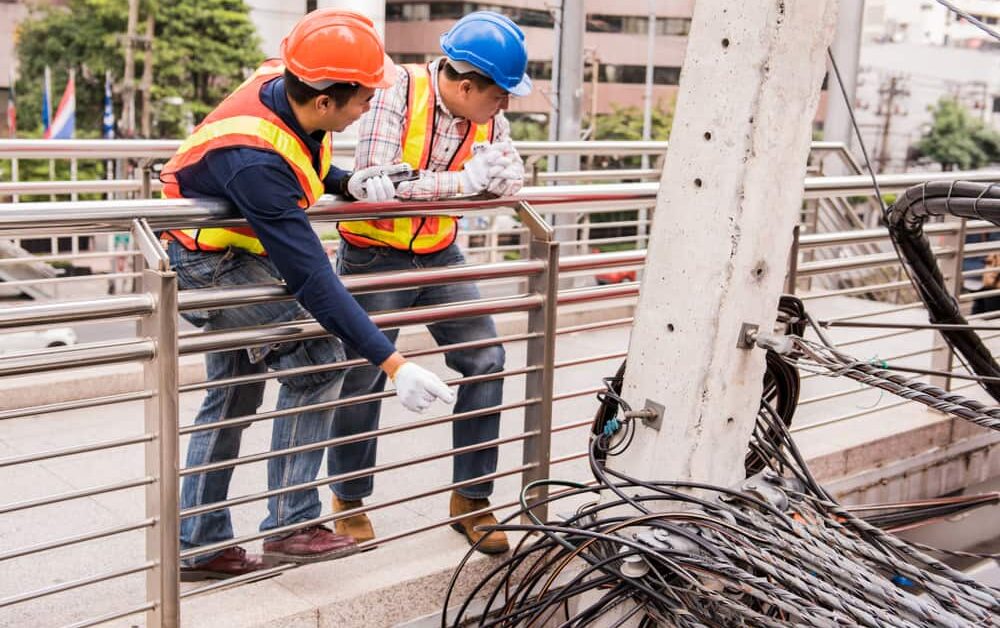 utility workers working outside in the elements